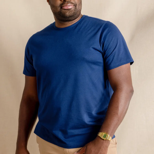 Everyman tee in royal blue with khakis and a gold watch, the cut sitting looser through the waist