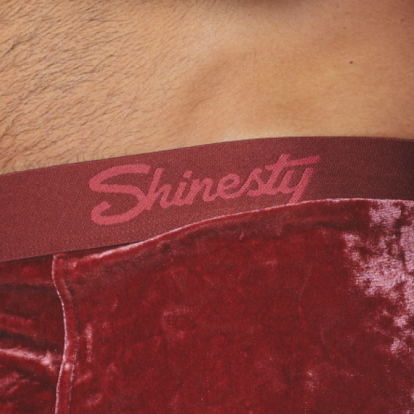 Crimson crushed velvet boxer briefs at the hip, Shinesty script on the tonal waistband
