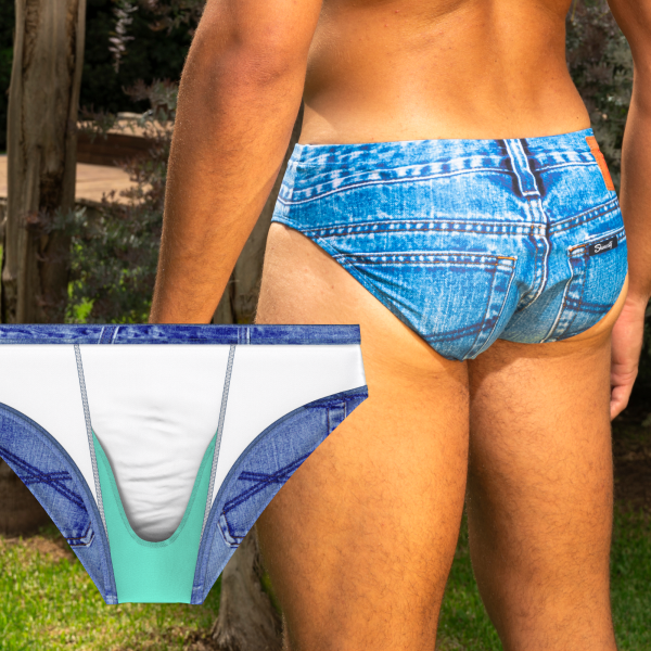 Back of denim-print swim briefs on a lawn, inset of the inside-out brief with its mint Ball Hammock pouch