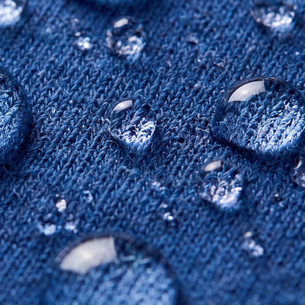 Pajama knit in navy dotted with water droplets that sit on the surface instead of soaking in
